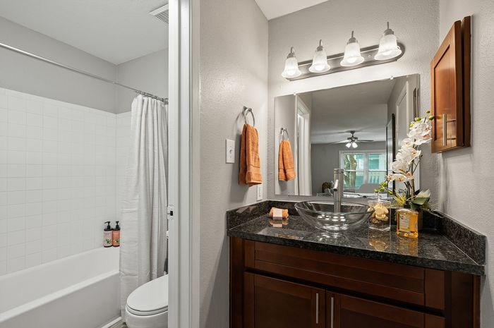 Lakeside at Campeche 2 bed 2 bath model front entrance looking into living room dinigroom and guest bathroom