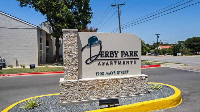 Charming entrance sign for Derby Park Apartments on 1200 Mays Street, showcasing a welcoming and stylish community vibe.