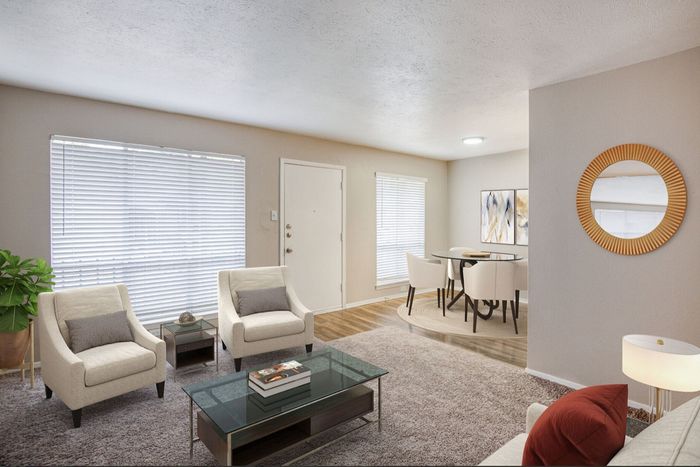 Modern living space with plush seating, chic glass coffee table, and elegant dining area, capturing warmth and style.