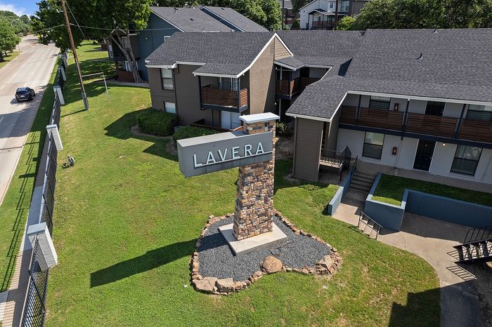 Charming apartment complex with modern architecture and welcoming green spaces at Lavera.