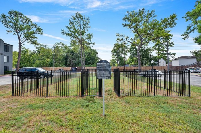 Pet-friendly feature: Charming fenced dog park surrounded by lush greenery, ideal for playful pups and social gatherings.