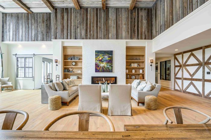 Resident lounge with sofas, armchairs, coffee tables and a fireplace.