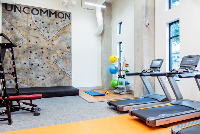Residents Working Out at Fitness Center | Fort Collins Colorado Apartments | Uncommon Fort Collins