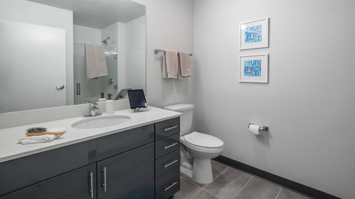Spacious, large, modern bathroom with tile flooring