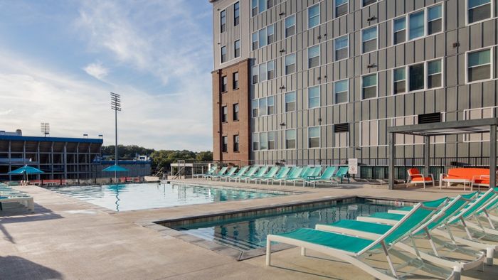 Luxury swimming pool, cabanas, grilling station, rooftop lounge, sun deck, and courtyard