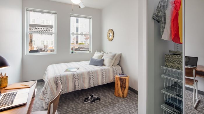 Spacious College Bedrooms, furnished with bed, desk, and chair, study, full sized mattress