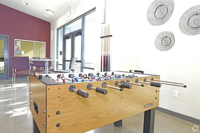 Resident Playing Pool | Apartments Near Sacramento State | University Village