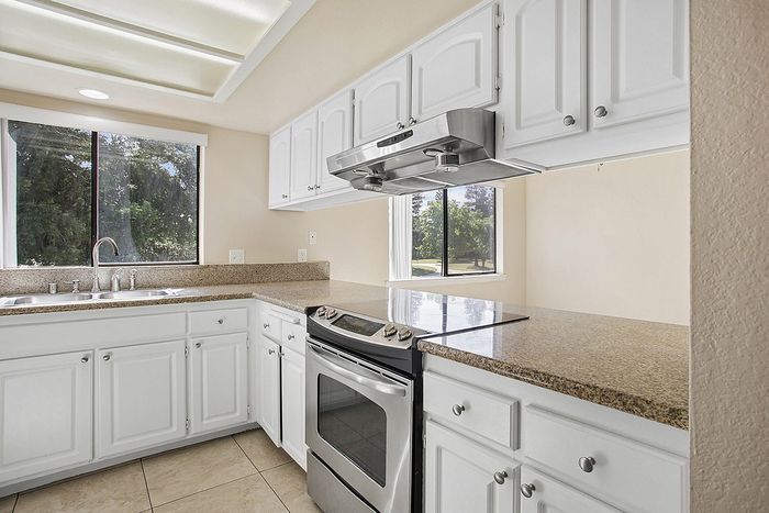 Bright Kitchen with granite and modern appliances