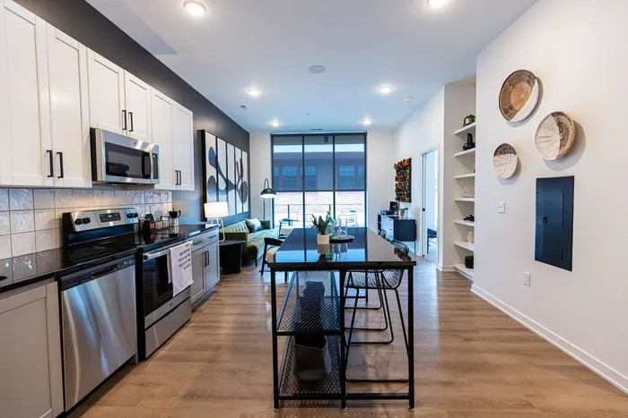 Featuring an adjustable island in the kitchen