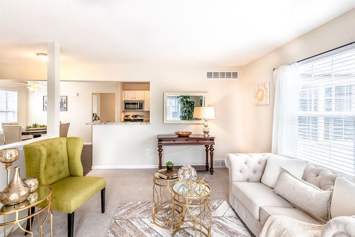 Residents Lounging in the Living Room | East Amherst NY Apartments For Rent | Autumn Creek Apartments
