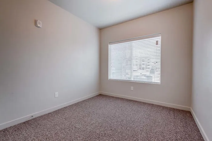 Guest bedroom with large window