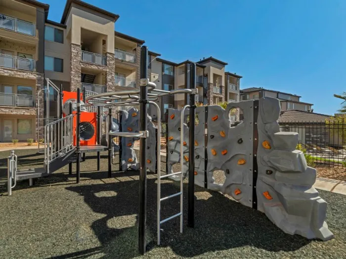 Playground with 2 slides and climbing wall