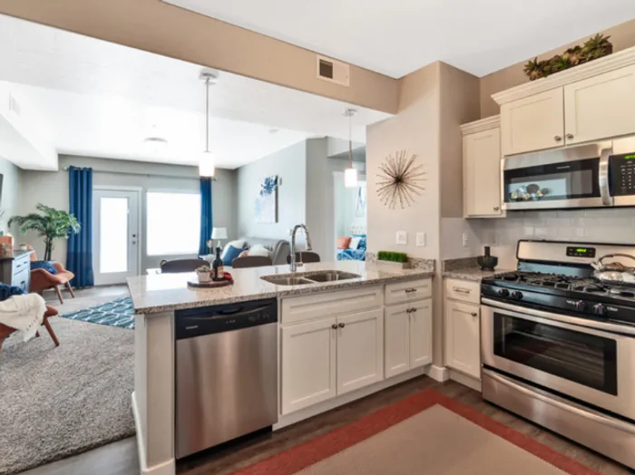 Kitchen with stainless steel appliances and walk-in pantry