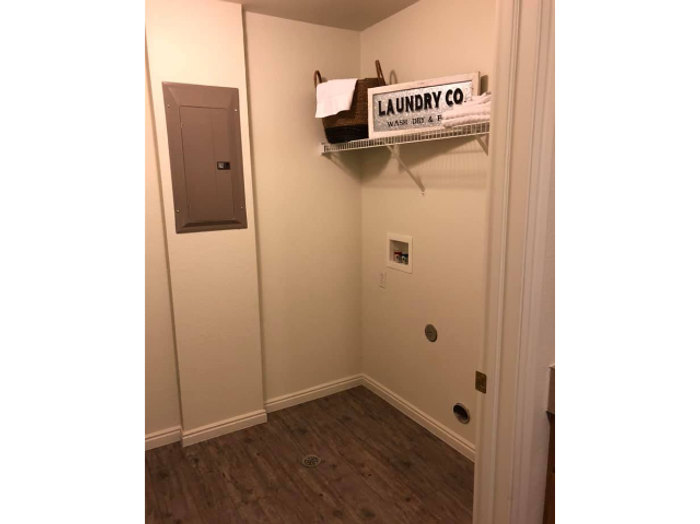 Laundry room with washer and electric dryer hookups