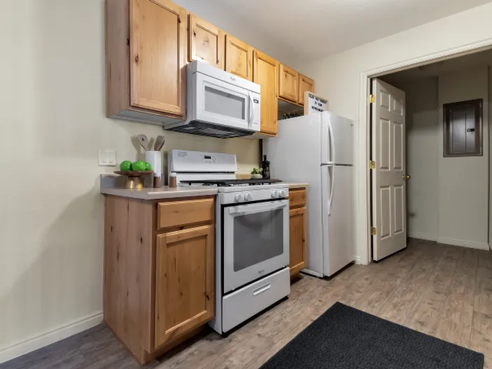 Kitchen View of Gas Stove and Fridge