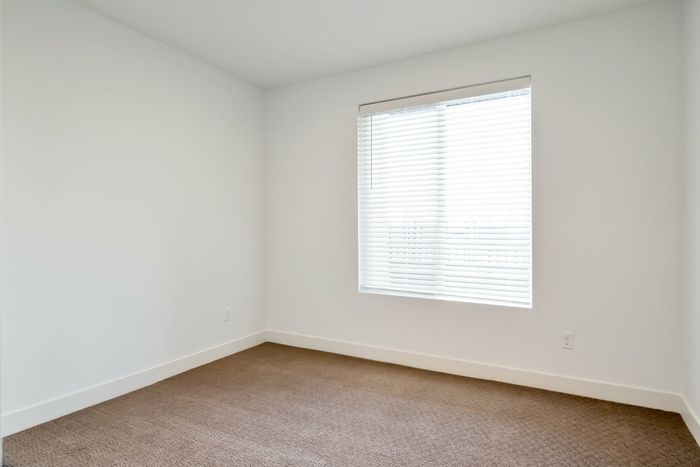 View of the Brighton Bedroom with tan carpet.
