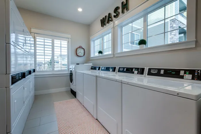 Laundry room with 4 washers and 6 dryers