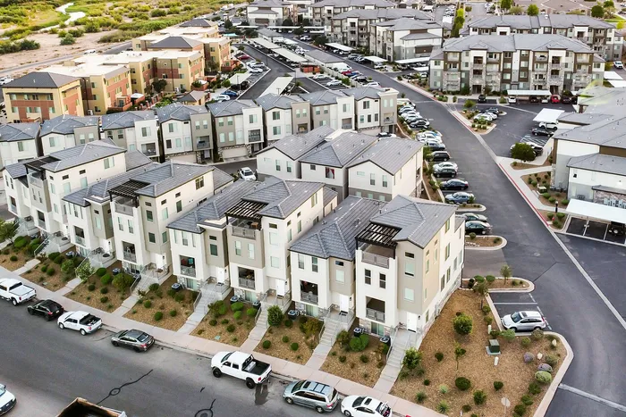 Chic modern townhouse community with sleek design, ample parking, and beautiful landscaping, offering contemporary living in a vibrant neighborhood.