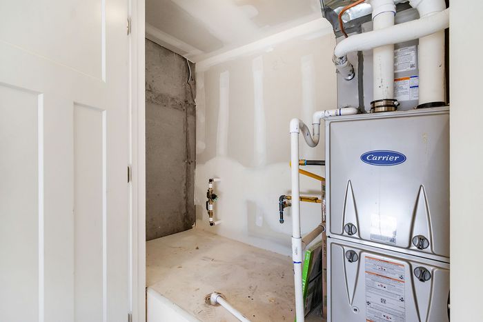 Modern utility room featuring a high-efficiency HVAC system, designed for optimal home comfort and energy savings.