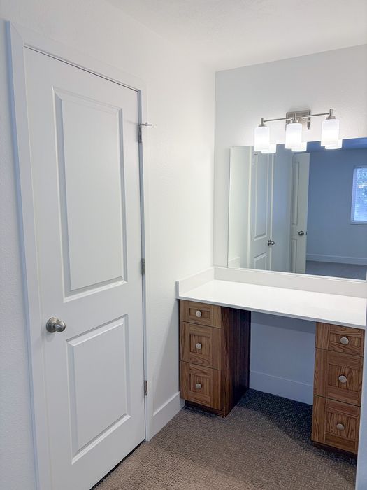 Dedicated vanity space adds convenience and functionality to your daily routine.