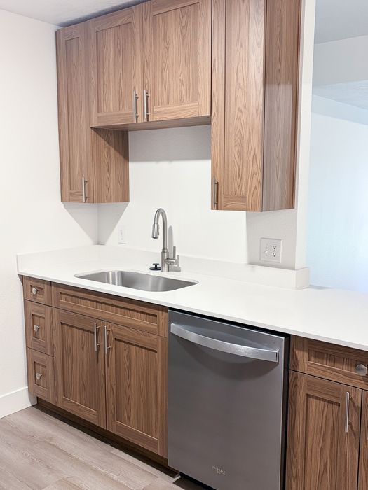 Freshly renovated kitchens featuring sleek countertops, upgraded fixtures, and abundant cabinet storage.