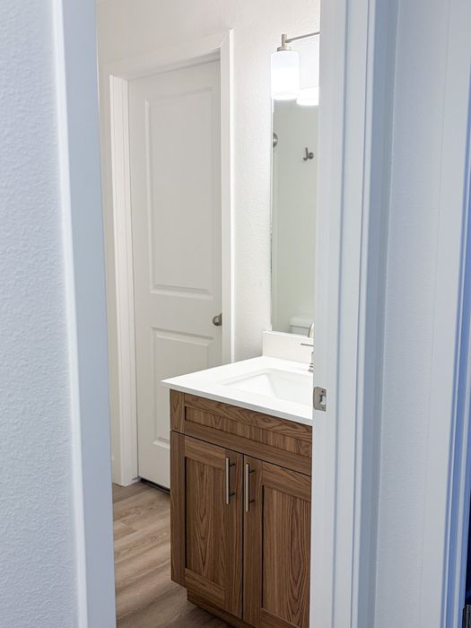 Updated bathrooms showcase modern cabinetry, stylish fixtures, and clean contemporary finishes.