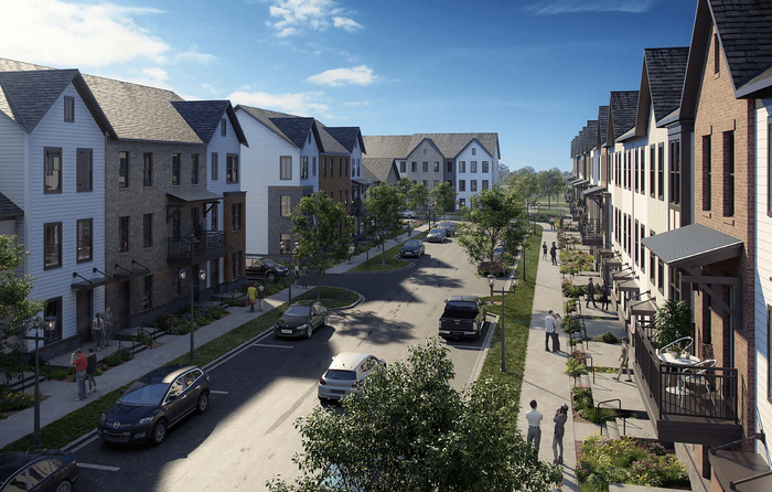 Charming suburban street lined with modern townhouses and bustling sidewalks, under a clear blue sky.