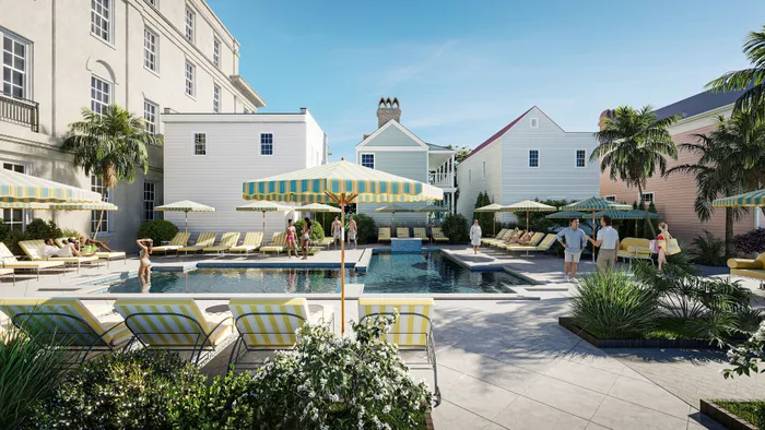Luxurious outdoor pool area with striped loungers and umbrellas, surrounded by charming buildings and lush greenery, perfect for relaxation and socializing.