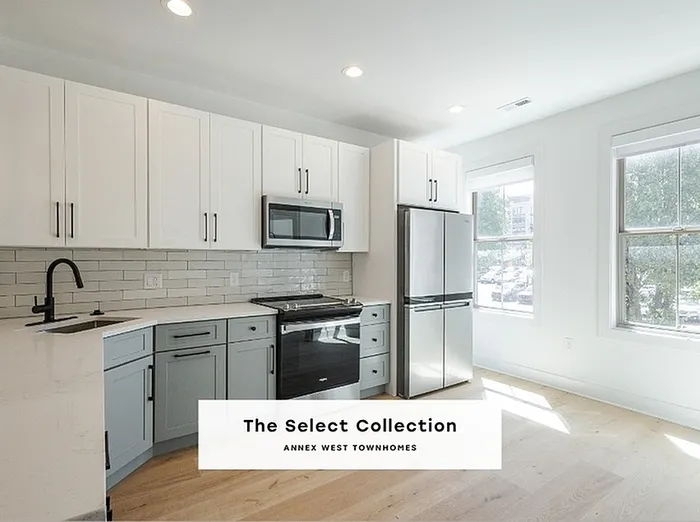 Bright and modern kitchen with sleek cabinetry and stainless steel appliances, perfect for stylish cooking and entertaining.