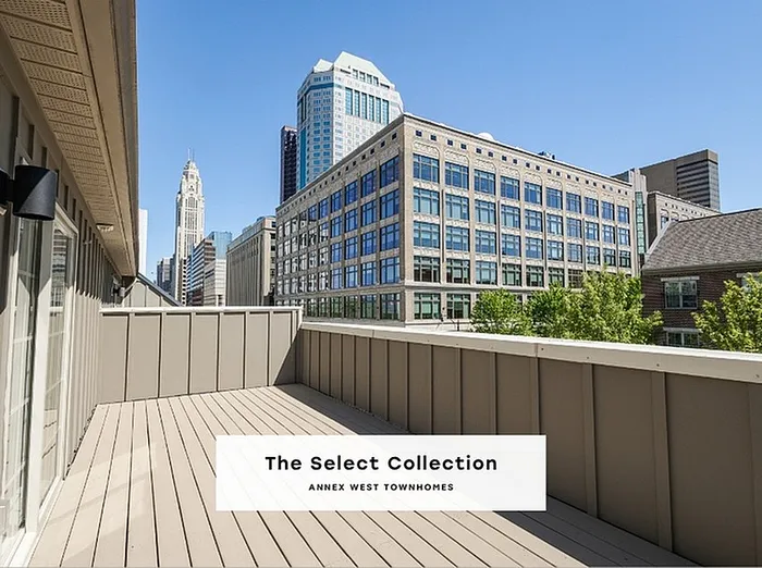 Expansive townhome balcony offering stunning cityscape views of downtown skyscrapers with The Select Collection Annexe West Townhomes.