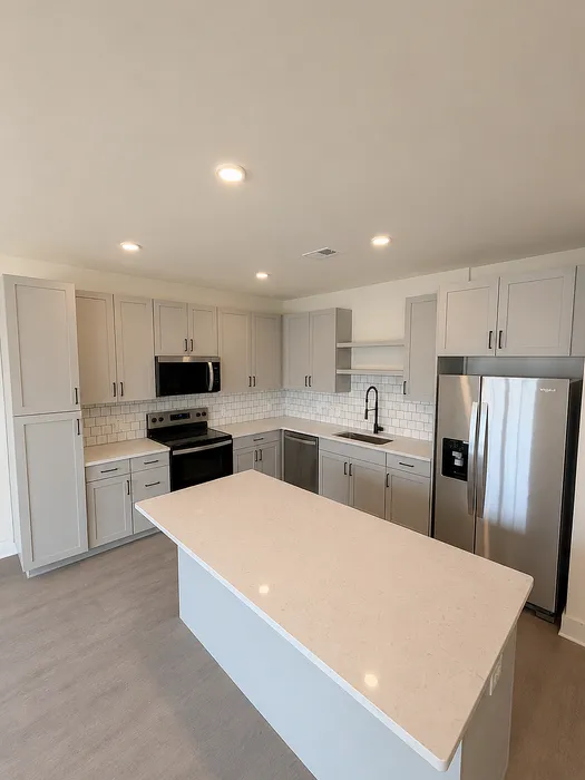 Modern kitchen design with sleek cabinets, spacious island, and stainless steel appliances for a stylish culinary experience.
