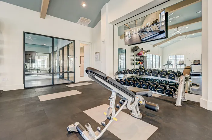 State-of-the-art fitness center with strength training equipment and free weights