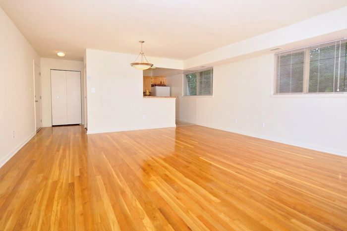 living room dining room with hardwood floors and breakfast bar