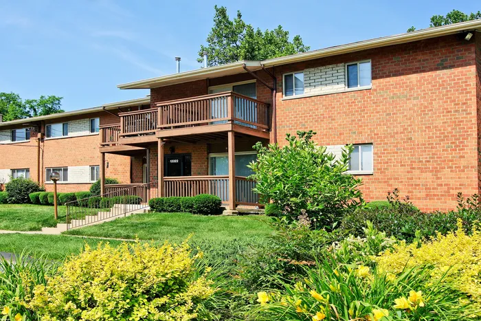 Exterior Brick Apt Building with Balconies and Patio
