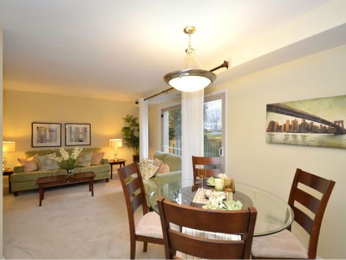 Dining Room with chandelier, Living Room with walkout patio