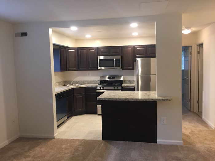Stainless steel kitchen appliances. updated dark cabinets. two kitchen entry