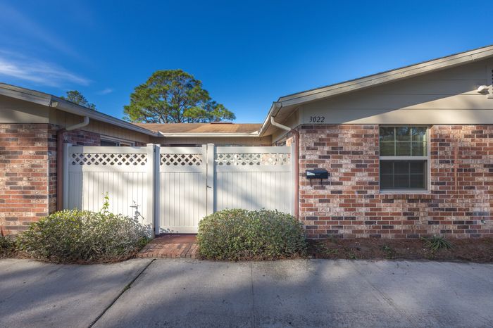 Beach Villas Apartments, exterior, walkways, single story brick building, privacy fences