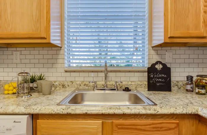 Canyon Square Apartments & Townhomes, interior, kitchen, window over sink, wood cabinets, dishwasher