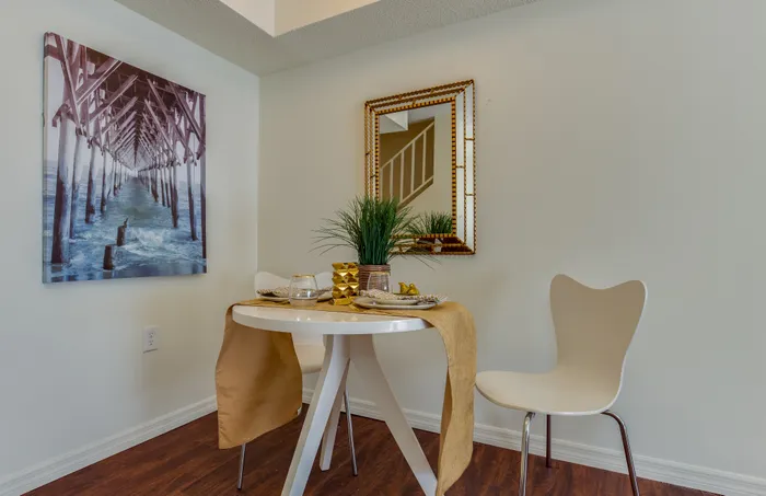 Canyon Square Apartments & Townhomes, interior, dining room, wood floor, table for two, mirror, wall art