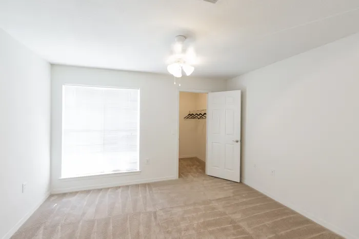 Creekside Park Apartments, interior, bedroom, large window, closet, carpet