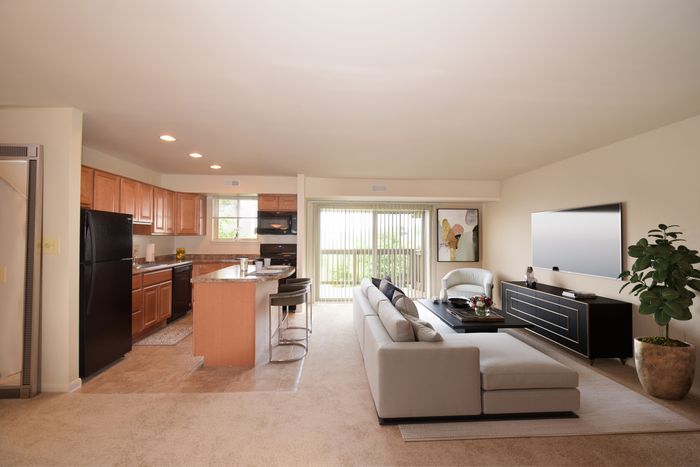 Fellowship Court, Interior, Living room, carpet, balcony, updated kitchen, island, black appliances, balcony, window in kitchen