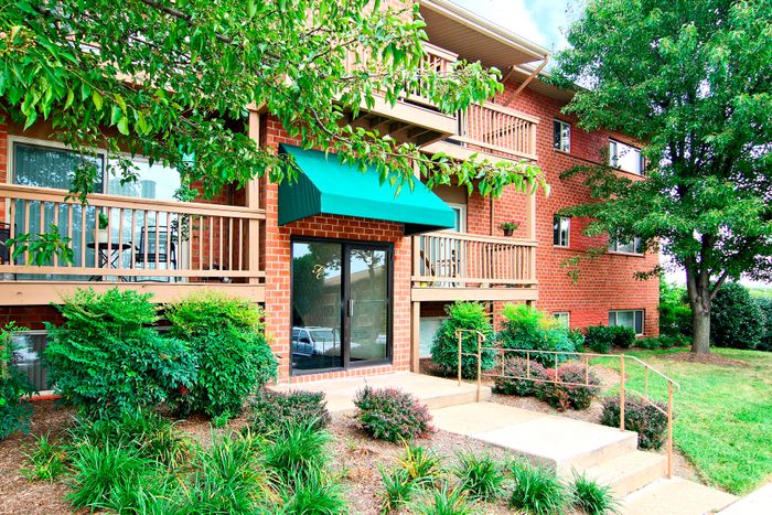 Entrance to brick apartment building.