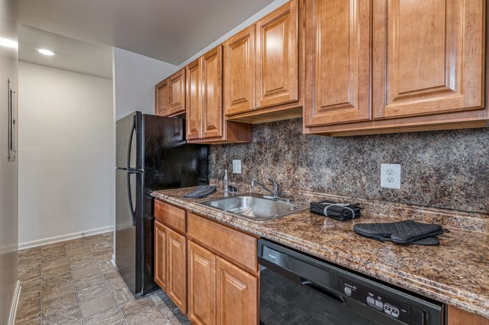 Kitchen fully updated with black appliances (gas range, dishwasher, microwave, fridge)