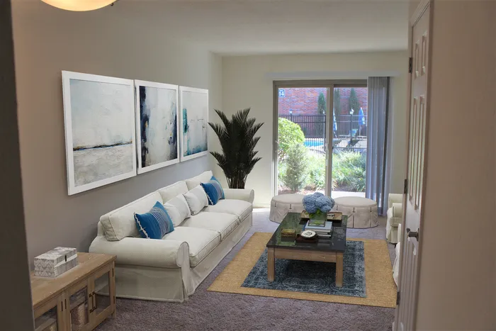 Living room with carpet and walk out patio