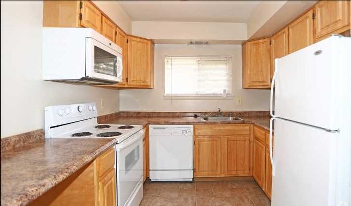 Belmont Apts; Interior, kitchen, electric range, dishwasher, oak cabinets, window in kitchen, wood plank floor