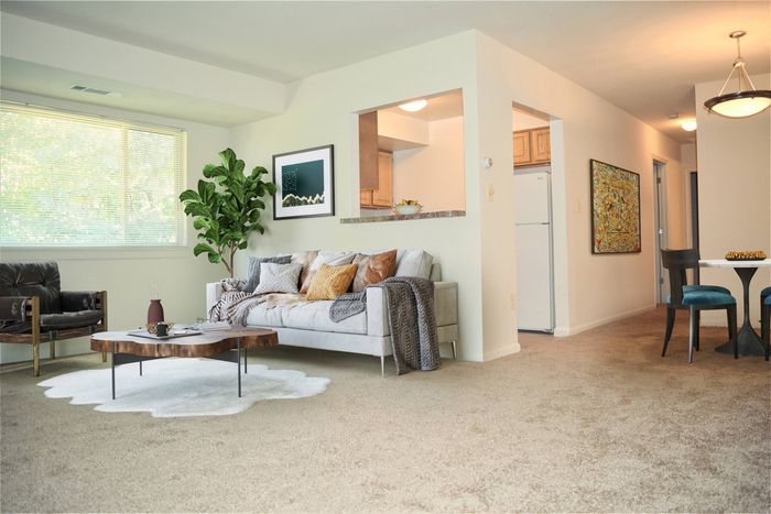 living room, dining room, wall to wall carpet, cutout to kitchen