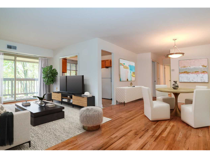 Living/Dining room with hardwood floors, balcony