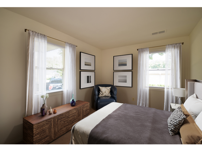 large bedroom with 2 windows