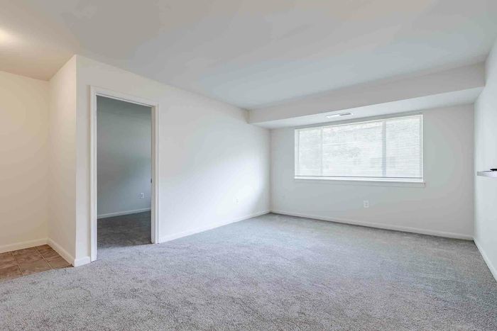 3 Bedroom Apartment. Living Room with large window.