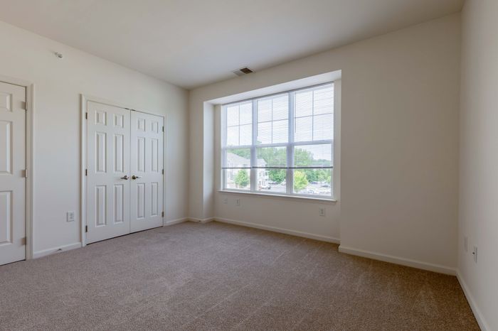 Bedroom with Closet Space and Natural Light